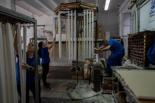 Employees work at the Bellido candle factory in Andujar, southern Spain