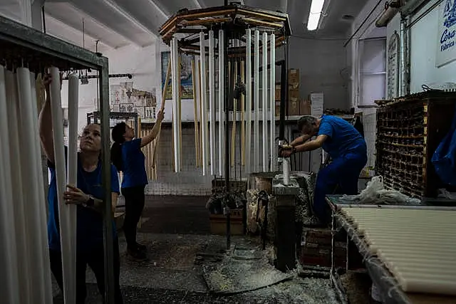 Employees work at the Bellido candle factory in Andujar, southern Spain