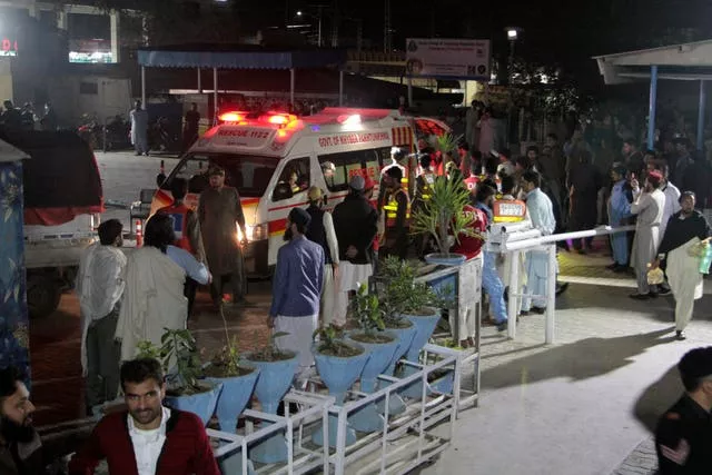 Rescue worker unload earthquake victims from an ambulance at a hospital in Saidu Sharif, a town Pakistan’s Swat valley, Tuesday, March 21, 2023