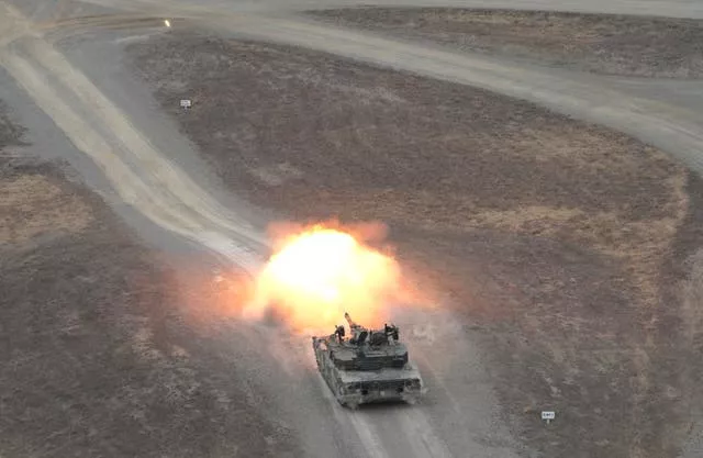 A South Korean army tank fires during a combined live-fire exercise between South Korea and the US 