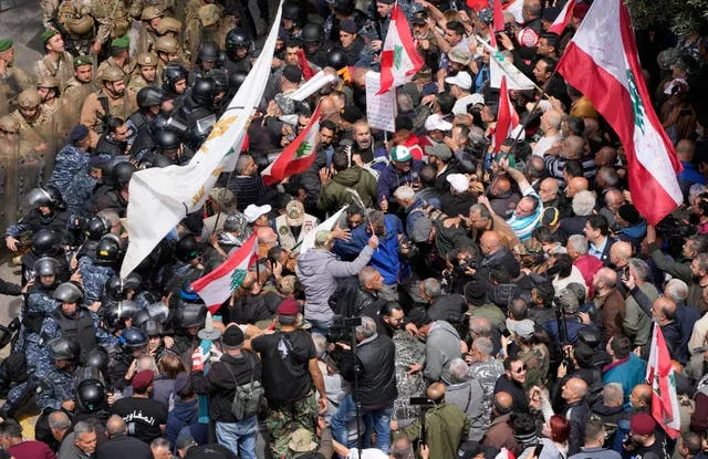 Retired army soldiers and other protesters clash with Lebanese army and riot police in Beirut 