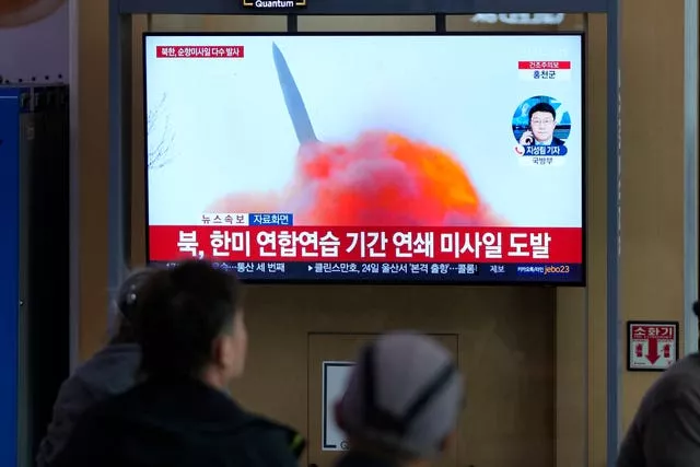 A TV screen showing news reports about North Korea’s missile launch 