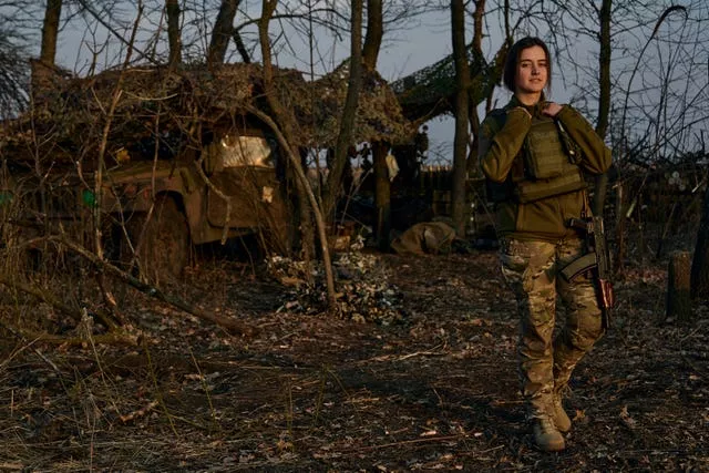 A Ukrainian soldier looks on from their position on the frontline in Bakhmut, Donetsk region, Ukraine, on Wednesday March 22 2023