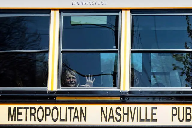 A child weeps while on the bus leaving The Covenant School (Nicole Hester/The Tennessean/AP)