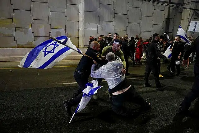 Israeli police scuffle with demonstrators blocking a motorway in Tel Aviv during a protest against plans by Prime Minister Benjamin Netanyahu’s government to overhaul the judicial system