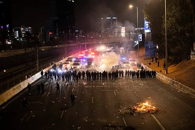 Israeli police disperse demonstrators blocking a motorway during a protest against plans by Prime Minister Benjamin Netanyahu’s government to overhaul the judicial system in Tel Aviv, Israel