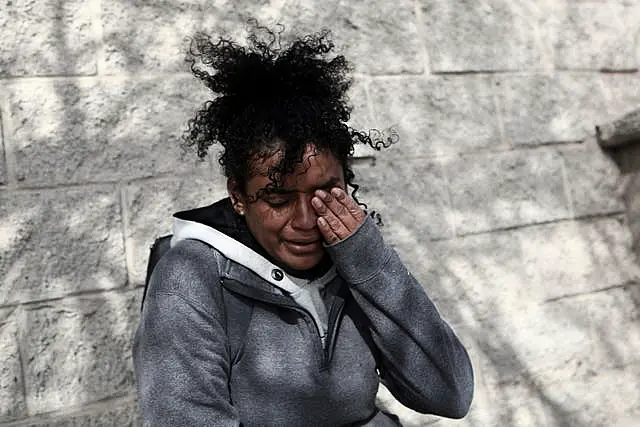 A Venezuelan migrant woman cries in front at of the immigration detention centre in Ciudad Juarez, Mexico 