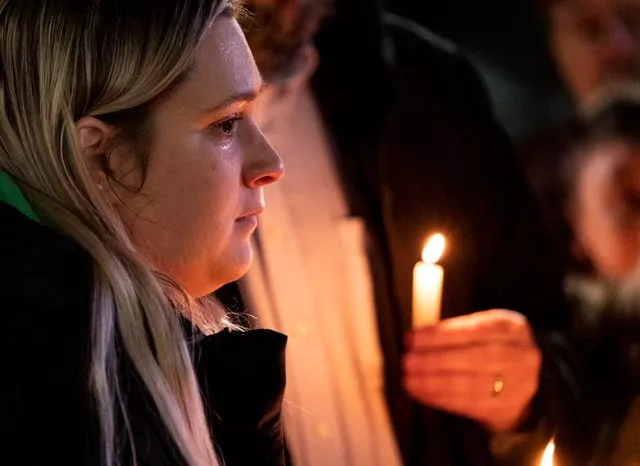Rosalie List, a coworker at Richneck Elementary, wipes a tear from her eye while speaking during a vigil for Abby Zwerner