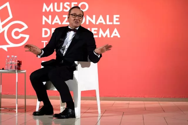 Actor Kevin Spacey talks while seatedat the National Museum of Cinema in Turin, Italy