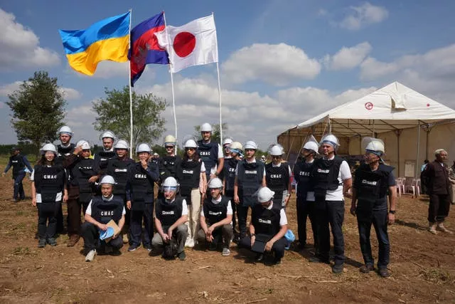 Ukrainian deminers pose for a group photo