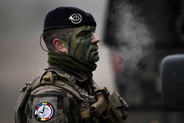 A French serviceman takes part in an exercise at a training range in Smardan, eastern Romania