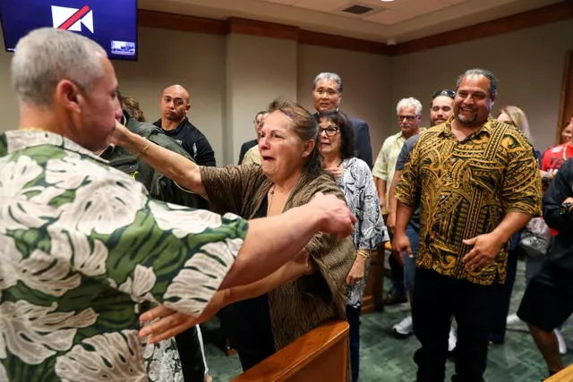 Albert 'Ian' Schweitzer, left, hugs his mother, Linda, moments after a judge ordered him released from prison