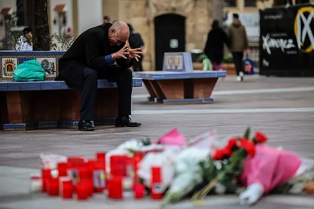 A man reacts next to a memorial site for a church sacristan who was killed in Algeciras, southern Spain 