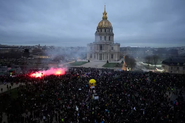 Protesters end the demonstration against plans to push back France’s retirement age, at the Invalides monument in Paris