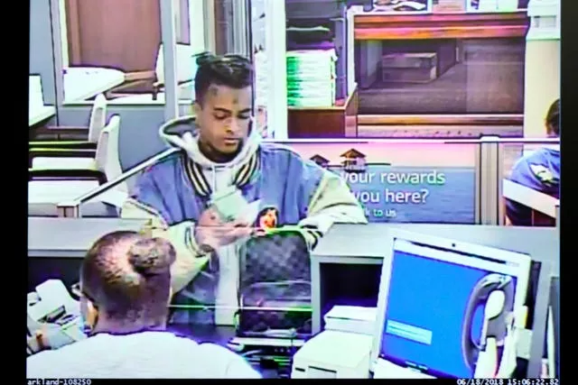 XXXTentacion places 50,000 dollars he withdrew from his account in a Louis Vuitton bag at a Bank of America branch on June 18 2018