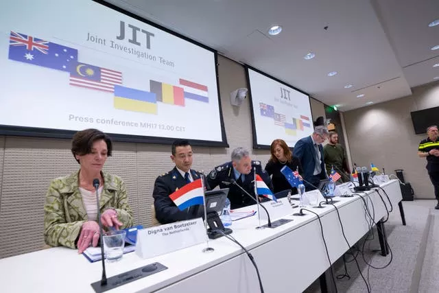 Digna van Boetzelaer, Andy Kraag, David McLean, Asha Hoe Soo Lian, Eric van der Sypt and Oleksandr Bannyk take their seats for the Joint Investigation Team news conference in The Hague