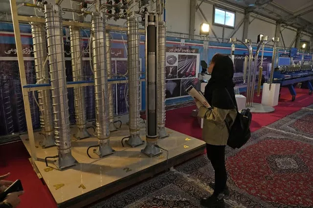 A student looks at Iran’s domestically built centrifuges in an exhibition of the country’s nuclear achievements in Tehran, Iran
