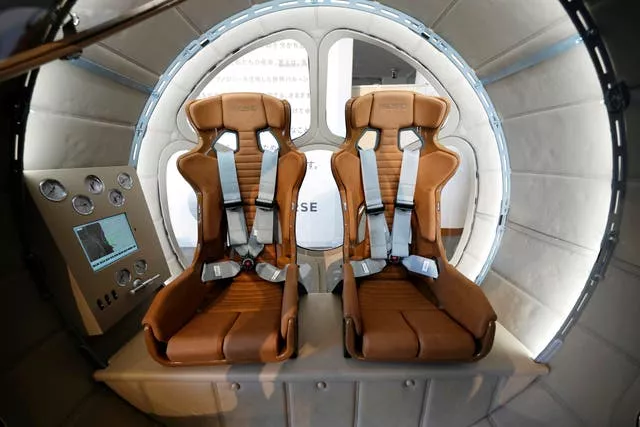 A two-seater cabin that a startup company says is capable of rising to an altitude of 15 miles, which is roughly the middle of the stratosphere, is displayed during a news conference in Tokyo