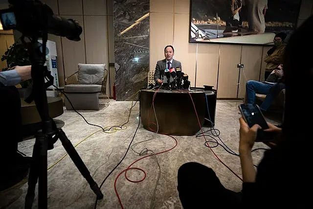 He Jiankui speaks at a brief press conference in Beijing