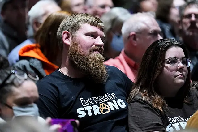 East Palestine residents listen to a town hall meeting at East Palestine High School concerning the February 3 Norfolk Southern freight train derailment in East Palestine, Ohio