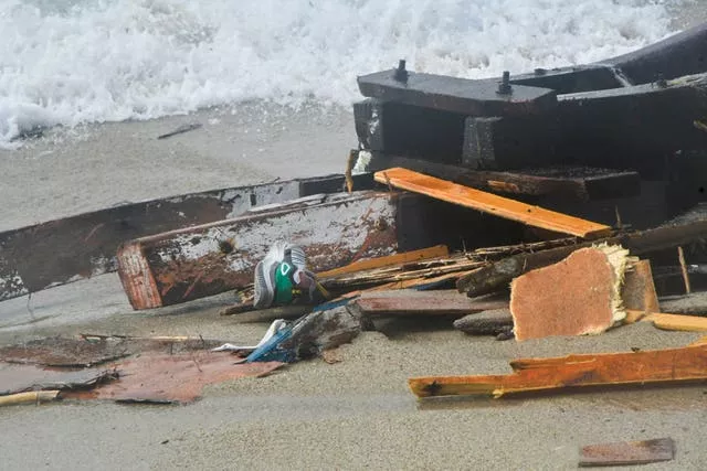 The wreckage from a capsized boat washes ashore (Giuseppe Pipita/AP)