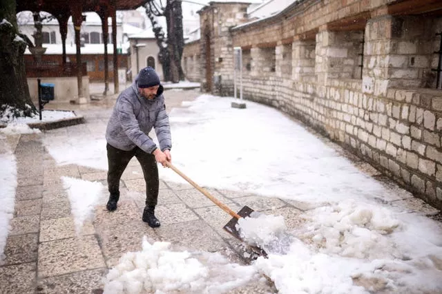 Shovelling snow in Bosnia