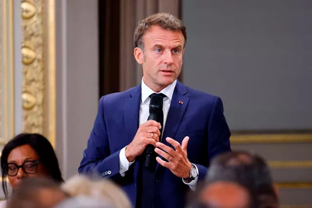 French President Emmanuel Macron addresses mayors of cities affected by the violent clashes