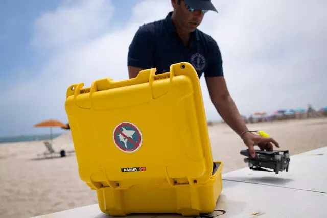 A drone is prepared for a shark patrol flight