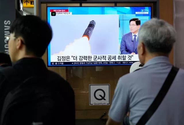 A TV screen shows an image of North Korea’s missile launch during a news programme at Seoul Railway Station in South Korea