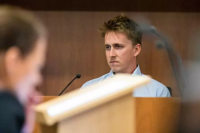 Pilot Brian Depauw reacts in the witness box at the Whakaari White Island eruption trial at the Auckland Environment Court in Auckland, New Zealand