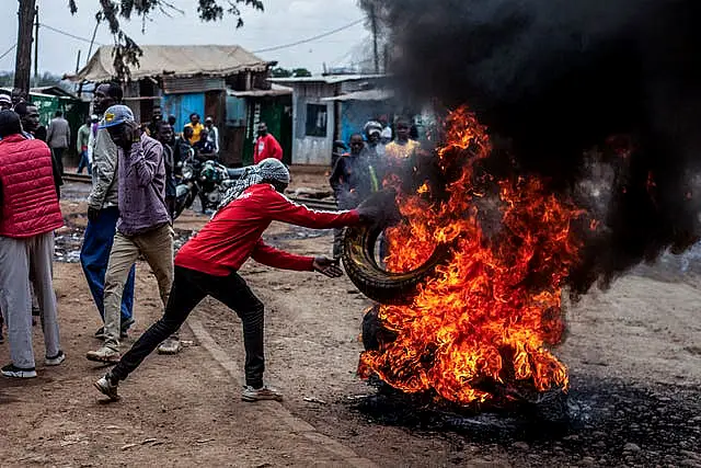 Protesters burn tires