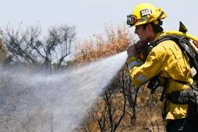 Firefighter with hose