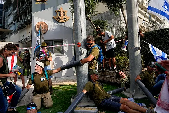 Israeli military reservists block the entrance to a military base as they protest against plans by Prime Minister Benjamin Netanyahu’s government to overhaul the judicial system