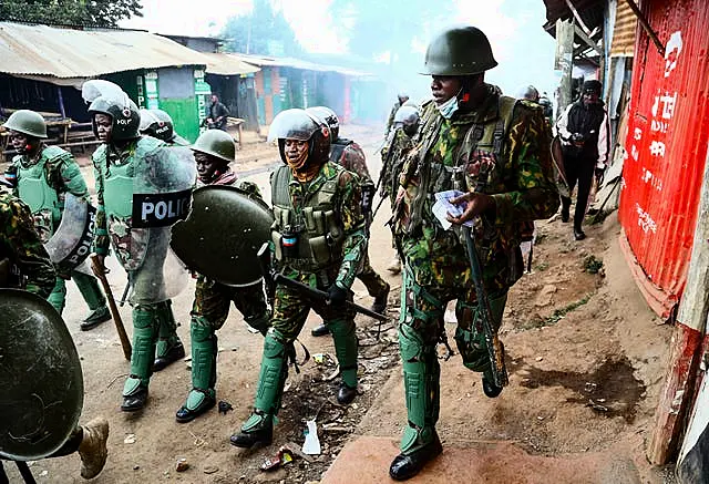 Riot police during clashes with protesters in the Kibera area of Nairobi