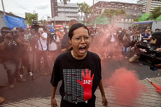 A supporter of Move Forward Party shouts during a protest outside parliament in Bangkok 