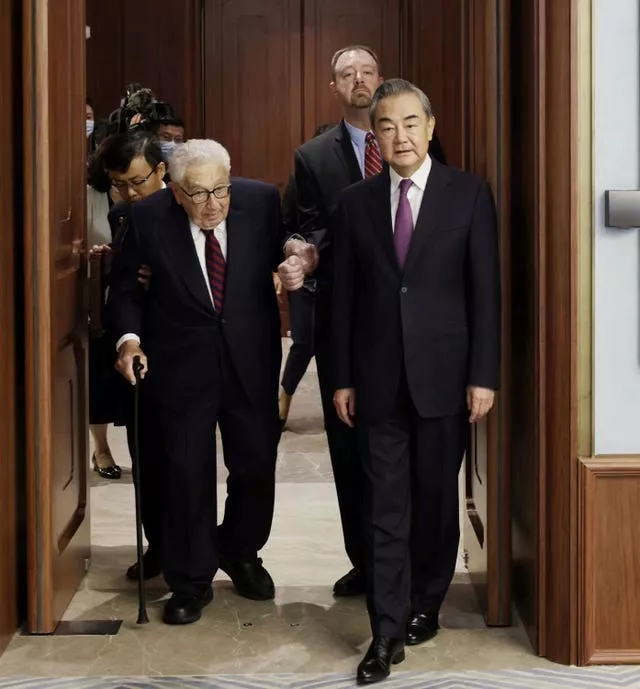 Former secretary of state Henry Kissinger, left, meets with Chinese state councillor Wang Yi in Beijing 