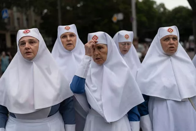 Nuns pray outside the Odesa Transfiguration Cathedral in Odesa following Russian missile attacks