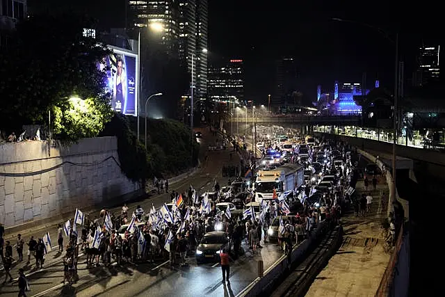 Demonstrators in Tel Aviv block traffic on a motorway crossing the city during a protest against plans by Benjamin Netanyahu’s government to overhaul the judicial system