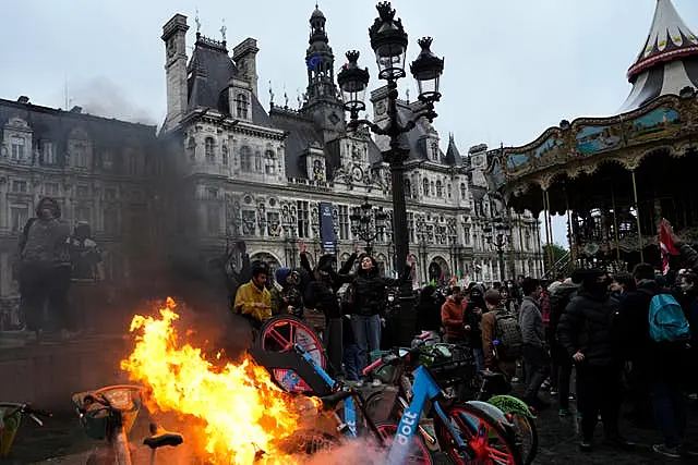 Bicycles burn during a protest outside Paris City Hall on Friday