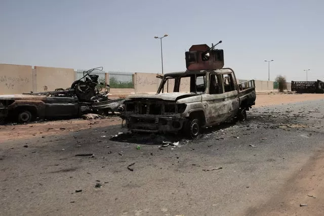 Destroyed military vehicles are seen in southern Khartoum, Sudan