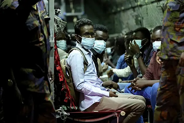 The first group of Kenyan evacuees from Sudan arrive at Jomo Kenyatta International Airport in Nairobi, Kenya, Monday