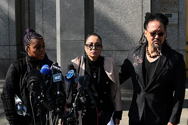 Kathryn Townsend Griffin, centre, the daughter of singer and songwriter Ed Townsend, speaks outside court before the hearing starts