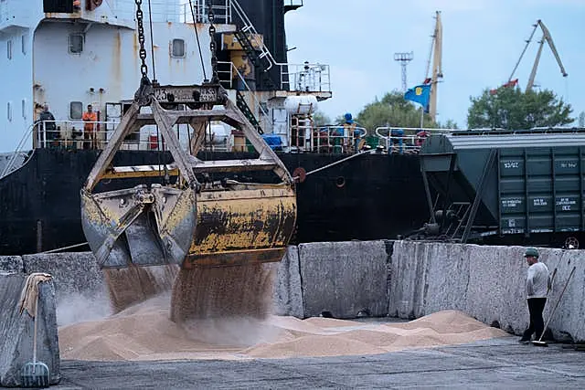 Workers load grain at a grain port in Izmail, Ukraine