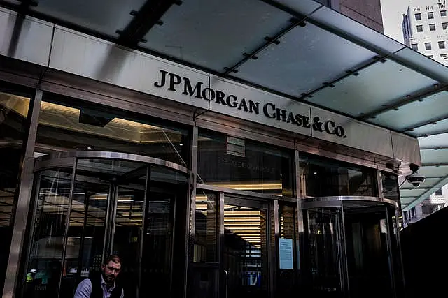 A person walks through an entrance at JPMorgan Chase headquarters on Madison Avenue in New York