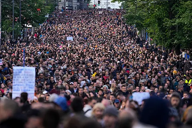 People march during a rally against violence in Belgrade on May 12 