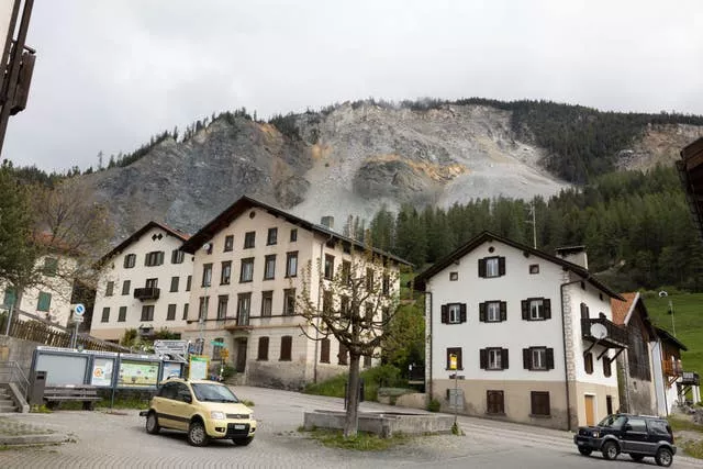 Residential buildings stand in front of the 'Brienzer Rutsch', the rockfall danger zone in Brienz-Brinzauls, Switzerland 