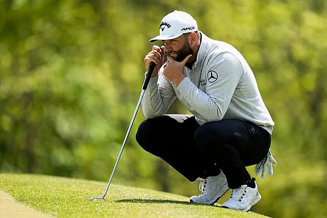 Jon Rahm, of Spain, lines up a putt on the 14th hole during the first round of the PGA Championship golf tournament at Oak Hill Country Club on Thursday, May 18, 2023, in Pittsford