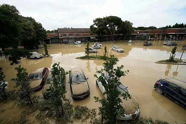 Mud covers cars in Faenza, Italy