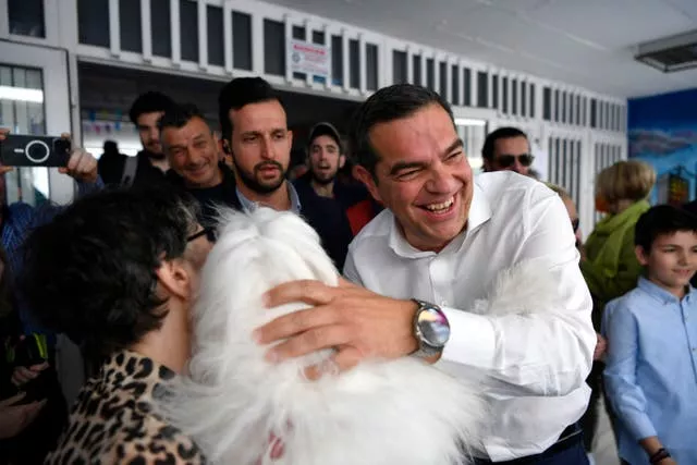 Alexis Tsipras, leader of the main opposition Syriza party, greeting his supporters at a polling station in Athens, Greece 