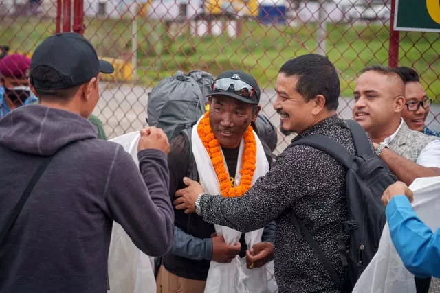 Veteran Sherpa guide Kami Rita returning after scaling Mount Everest for the 28th time arrives at the airport in Kathmandu, Nepa